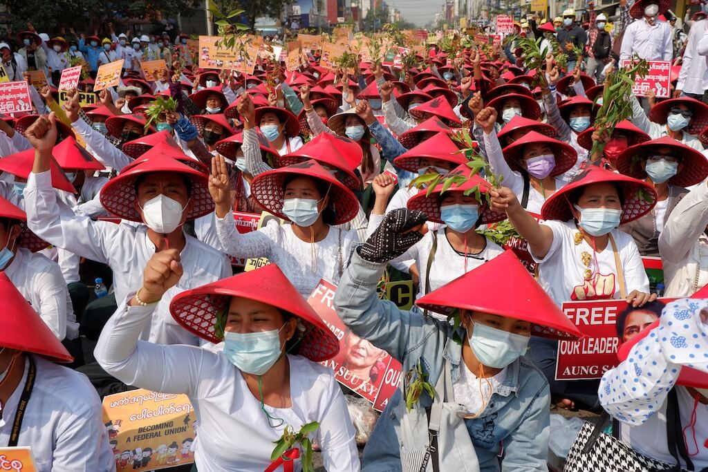 People gather to protest against the military coup in Mandalay, Myanmar on February 28, 2021. Photo by Stringer via Anadolu Images