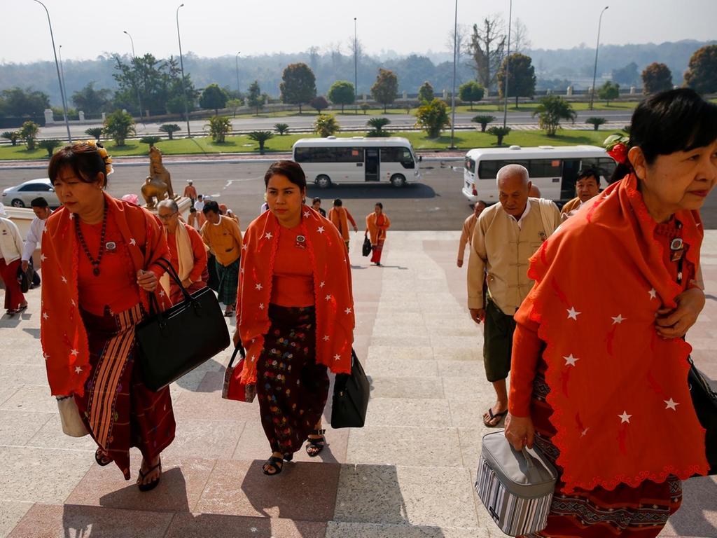 Members of parliament from National League for Democracy (NLD) party, led by Aung San Suu Kyi, wearing protective face masks arrive to attend the Assembly of the Union at the parliament building in Naypyitaw, Myanmar, 10 March EPA