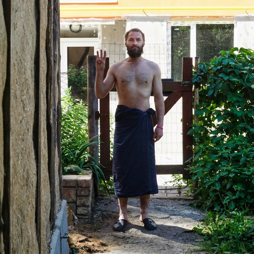 The author’s Ukrainian friend Petro in his home near Kyiv, with his 3-finger solidarity gesture for Myanmar’s New Oo Revolution, 2021.