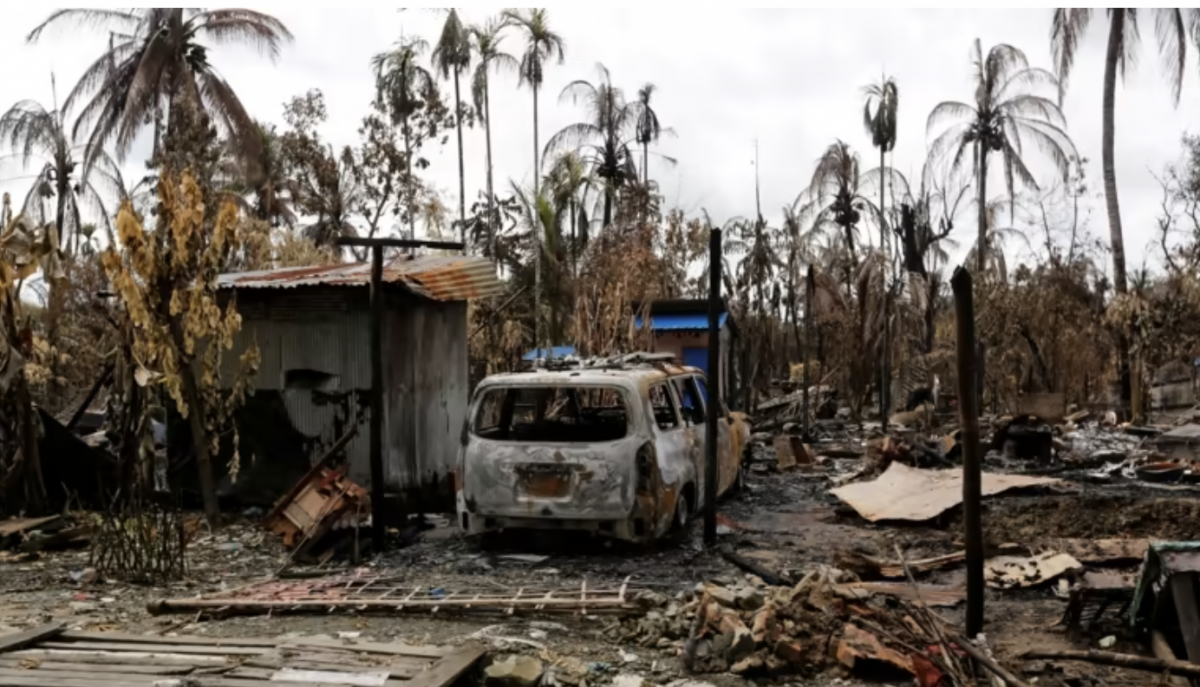 A burned car and house are seen in Maungdaw, Myanmar, where Rohingya villages were torched during a military onslaught in 2017. © Reuters