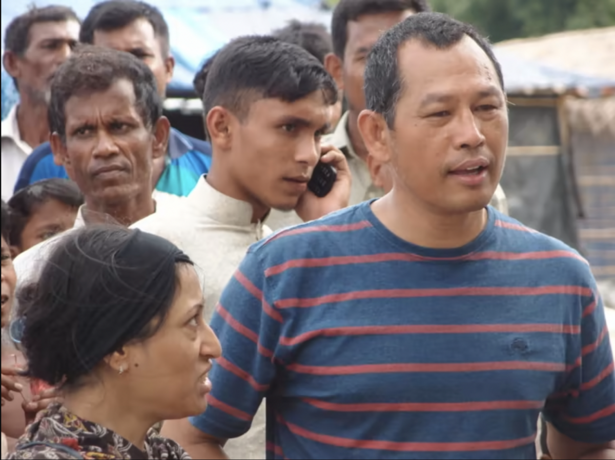 Myanmar scholar and human rights activist Maung Zarni, right, meets Rohingya refugees along the Myanmar-Bangladesh border in 2018. (Courtesy of Maung Zarni)